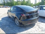 Tesla Model Y 7SAYGAEE2PF880108 photo