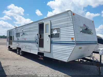 NOMAD  2001. Lot# 39726496. VIN 1SN900R291F001022. Photo 1