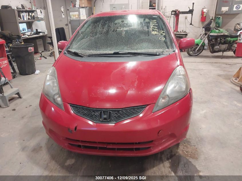 2009 Honda Fit Lx VIN: JHMGE88579S812331 Lot: 30077406