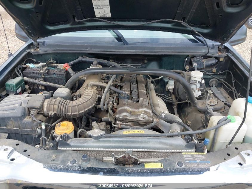 2003 Chevrolet Tracker VIN: 2CNBJ13C736942409 Lot: 30064937