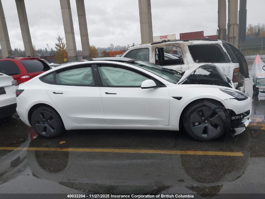 2023 Tesla Model 3 VIN: 5YJ3E1EB1PF699052 Lot: 40032204