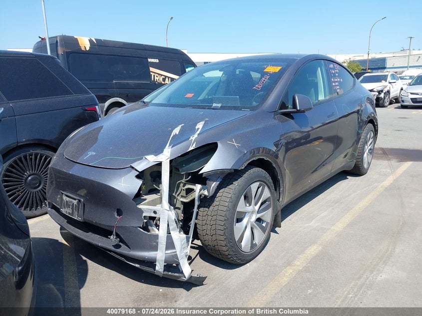 2023 Tesla Model Y, Left Front, IAAI, VIN LRWYGDEE3PC228347 — photo 2