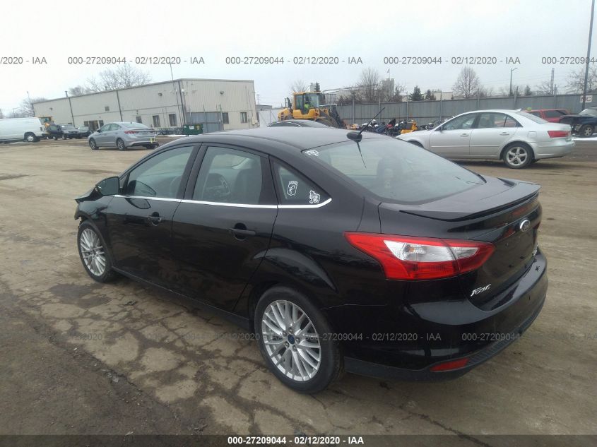 2014 Ford Focus Titanium VIN: 1FADP3J25EL310199 Lot: 27209044