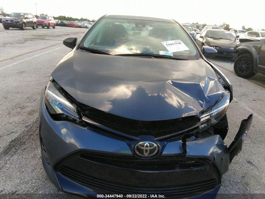 2018 Toyota Corolla Le VIN: 5YFBURHE9JP770125 Lot: 34447940