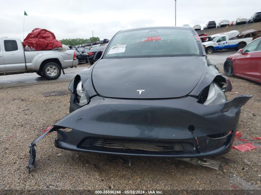 2023 Tesla Model Y Awd/Long Range Dual Motor All-Wheel Drive VIN: 7SAYGAEE4PF595409 Lot: 35596246