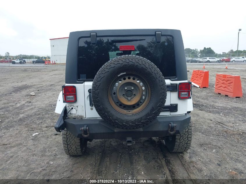 1C4BJWDG3EL200554 2014 Jeep Wrangler Unlimited Freedom Edition