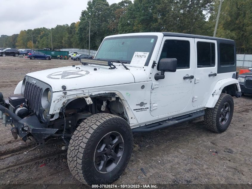 1C4BJWDG3EL200554 2014 Jeep Wrangler Unlimited Freedom Edition