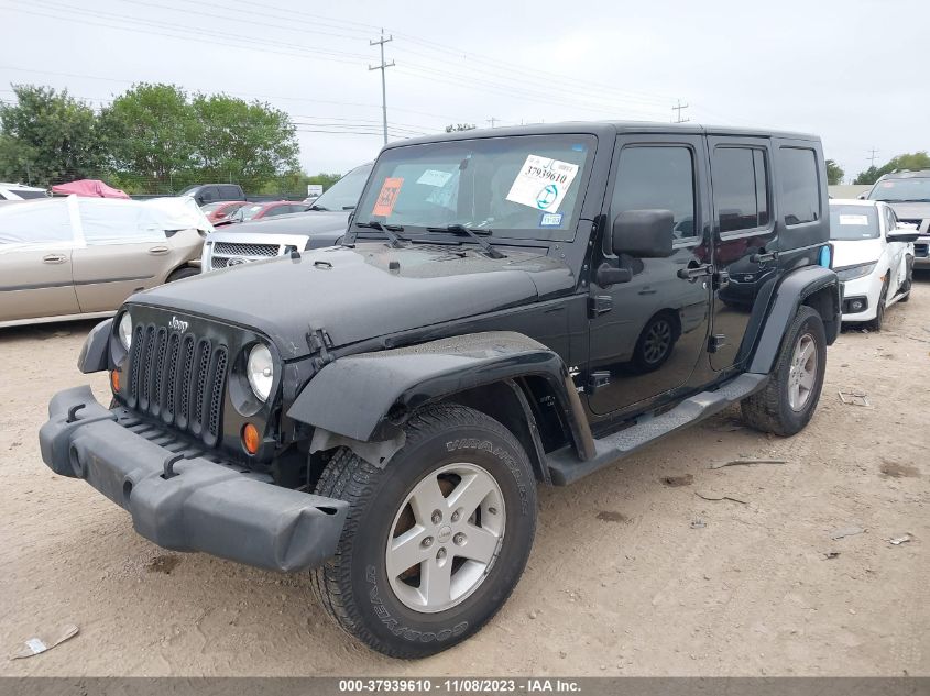 2007 Jeep Wrangler Unlimited Sahara VIN: 1J4GB59117L102749 Lot: 37939610