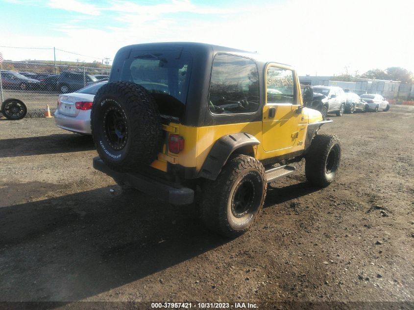 2000 Jeep Wrangler Sport VIN: 1J4FA49SXYP765166 Lot: 37957421