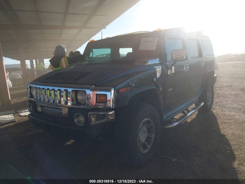 2003 Hummer H2 VIN: 5GRGN23U03H104499 Lot: 38318516