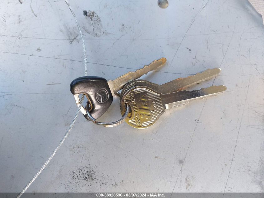 2001 Mazda 626 Es/Lx VIN: 1YVGF22C115242830 Lot: 38928596