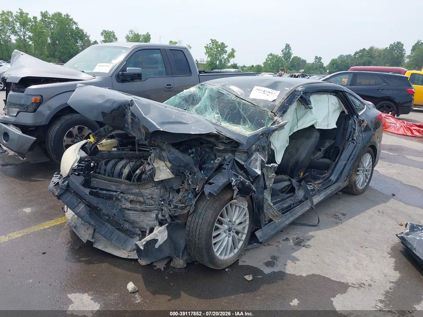 2014 Ford Focus Titanium 1FADP3J27EL234873 photo 1