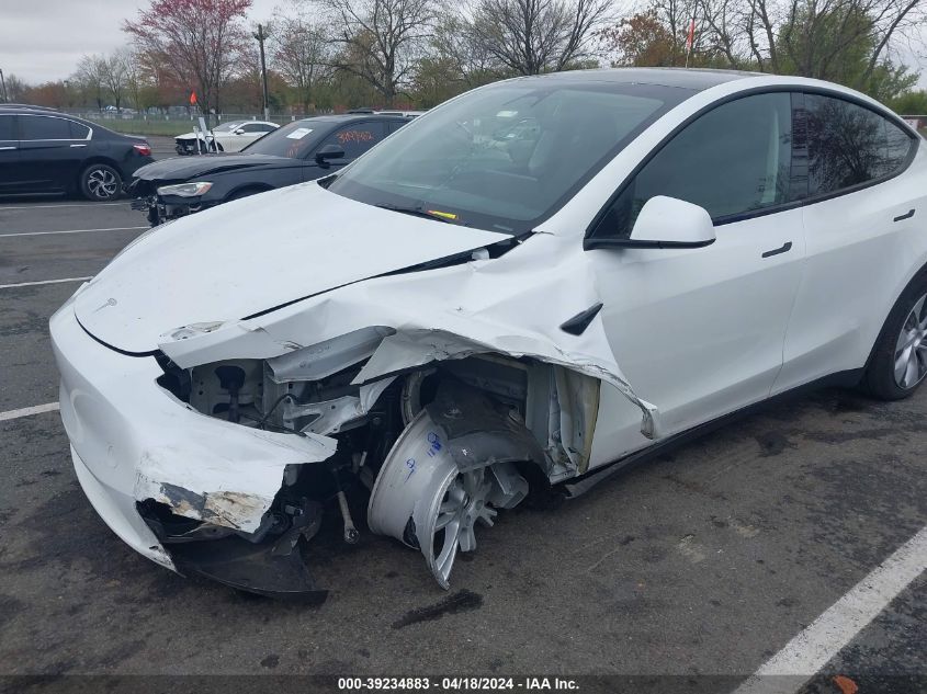 2023 Tesla Model Y Awd/Long Range Dual Motor All-Wheel Drive VIN: 7SAYGDEE3PA063213 Lot: 39234883