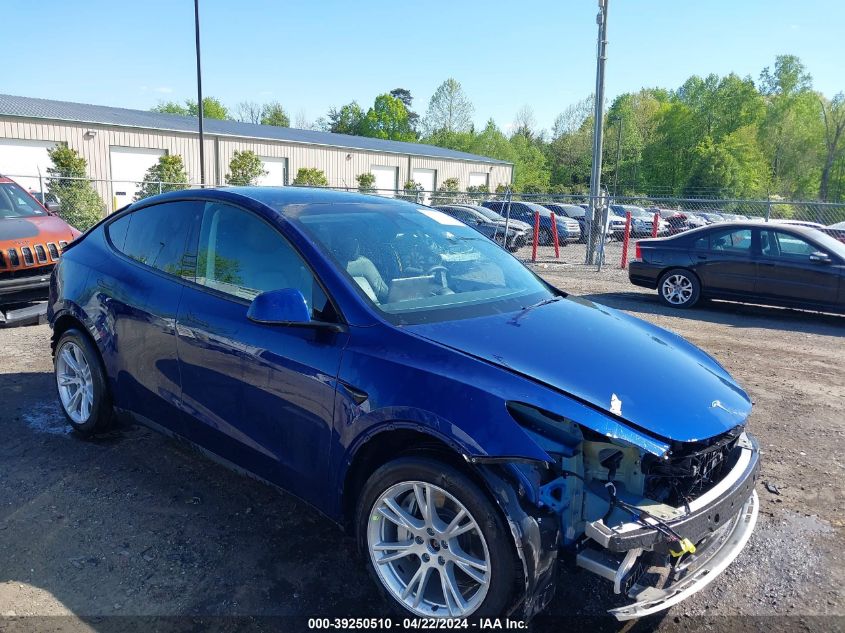 2023 Tesla Model Y Awd/Long Range Dual Motor All-Wheel Drive VIN: 7SAYGAEE2PF667255 Lot: 39250510