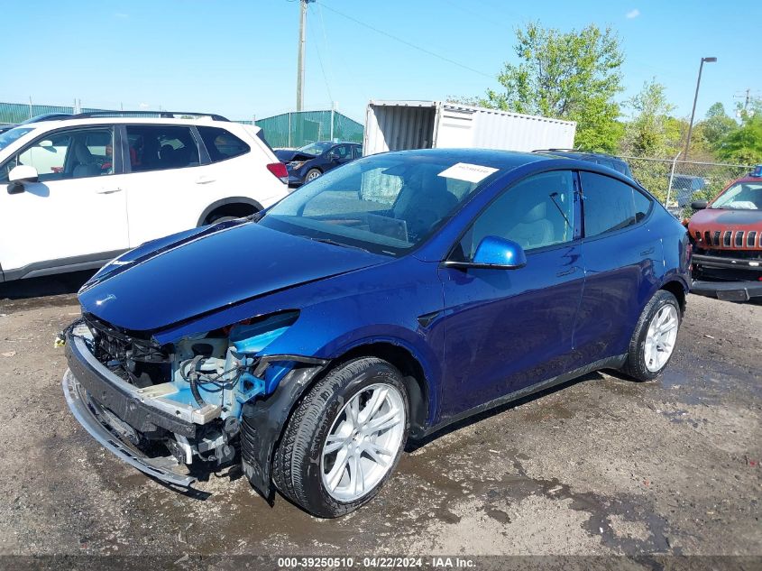 2023 Tesla Model Y Awd/Long Range Dual Motor All-Wheel Drive VIN: 7SAYGAEE2PF667255 Lot: 39250510