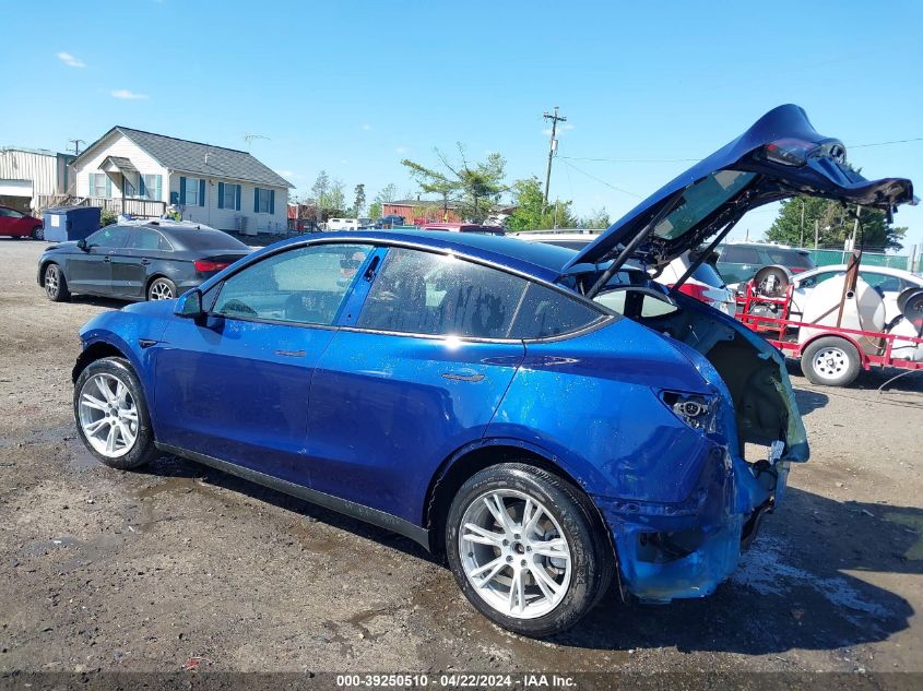 2023 Tesla Model Y Awd/Long Range Dual Motor All-Wheel Drive VIN: 7SAYGAEE2PF667255 Lot: 39250510