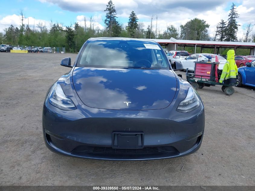 2023 Tesla Model Y Awd/Long Range Dual Motor All-Wheel Drive VIN: 7SAYGDEE4PF586209 Lot: 39339550