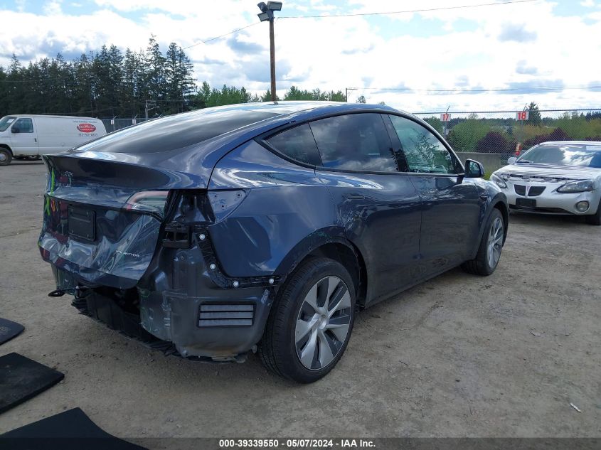 2023 Tesla Model Y Awd/Long Range Dual Motor All-Wheel Drive VIN: 7SAYGDEE4PF586209 Lot: 39339550