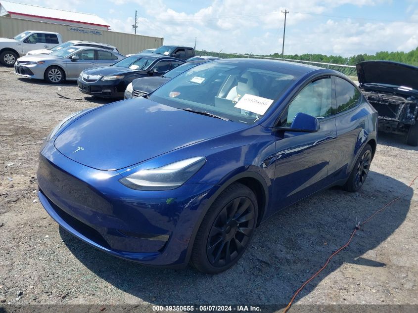 2023 Tesla Model Y Awd/Long Range Dual Motor All-Wheel Drive VIN: 7SAYGDEEXPA185275 Lot: 39350655