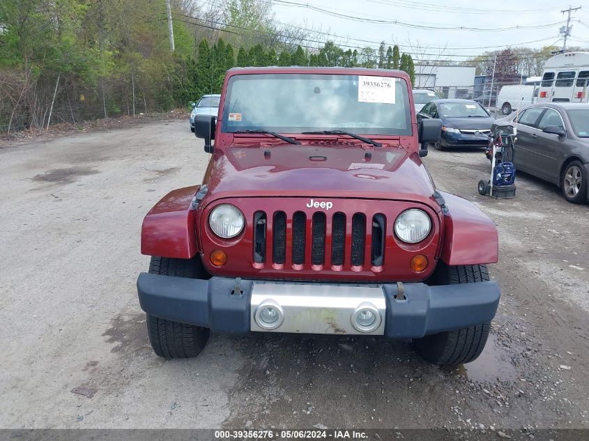 2009 Jeep Wrangler Unlimited Sahara VIN: 1J8GA59179L773380 Lot: 39356276