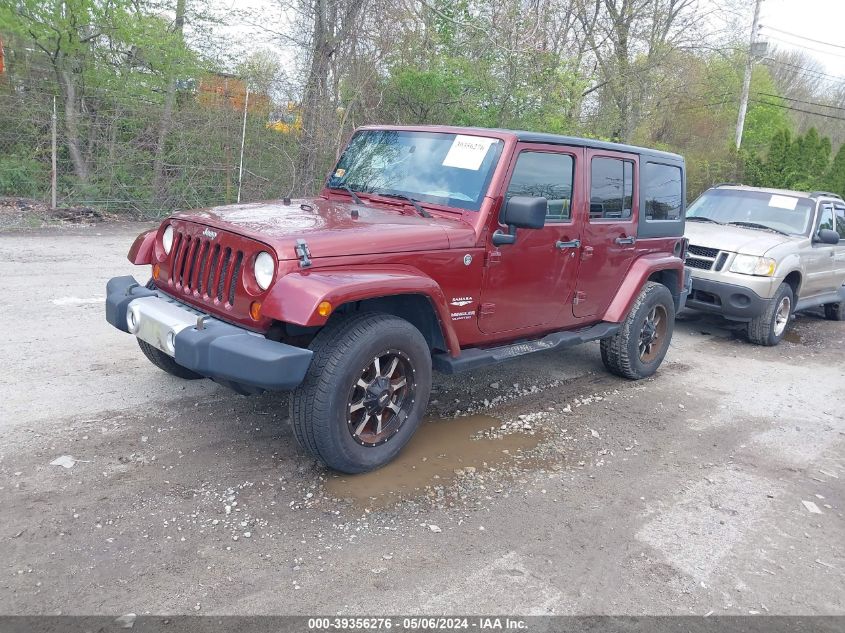 2009 Jeep Wrangler Unlimited Sahara VIN: 1J8GA59179L773380 Lot: 39356276