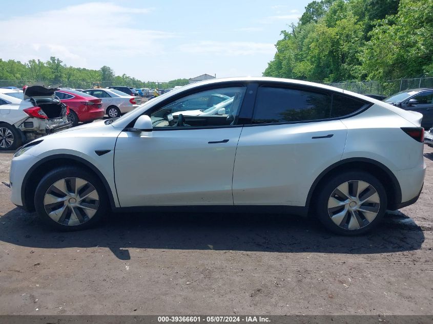 2023 Tesla Model Y VIN: 7SAYGDEF8PA048666 Lot: 39366601