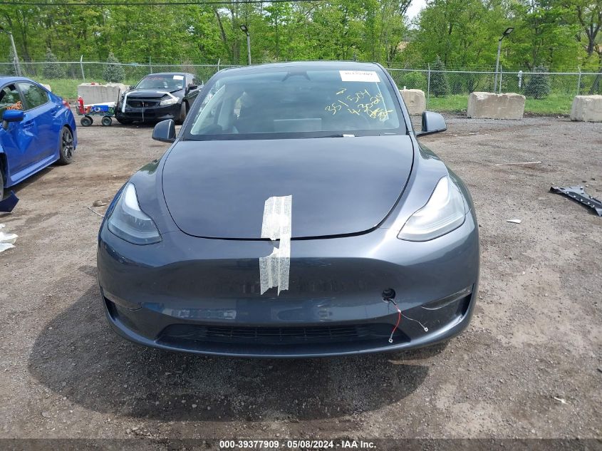 2023 Tesla Model Y Awd/Long Range Dual Motor All-Wheel Drive VIN: 7SAYGDEE4PF864011 Lot: 39377909