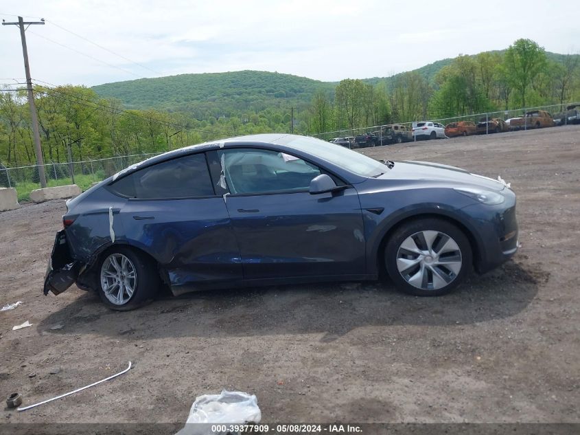 2023 Tesla Model Y Awd/Long Range Dual Motor All-Wheel Drive VIN: 7SAYGDEE4PF864011 Lot: 39377909