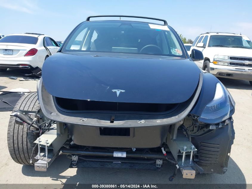 2023 Tesla Model Y Awd/Long Range Dual Motor All-Wheel Drive VIN: 7SAYGAEE0PF696138 Lot: 39380861