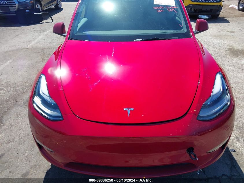 2023 Tesla Model Y Awd/Long Range Dual Motor All-Wheel Drive VIN: 7SAYGDEE9PF911338 Lot: 39386250