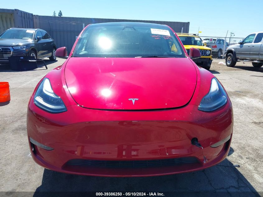 2023 Tesla Model Y Awd/Long Range Dual Motor All-Wheel Drive VIN: 7SAYGDEE9PF911338 Lot: 39386250