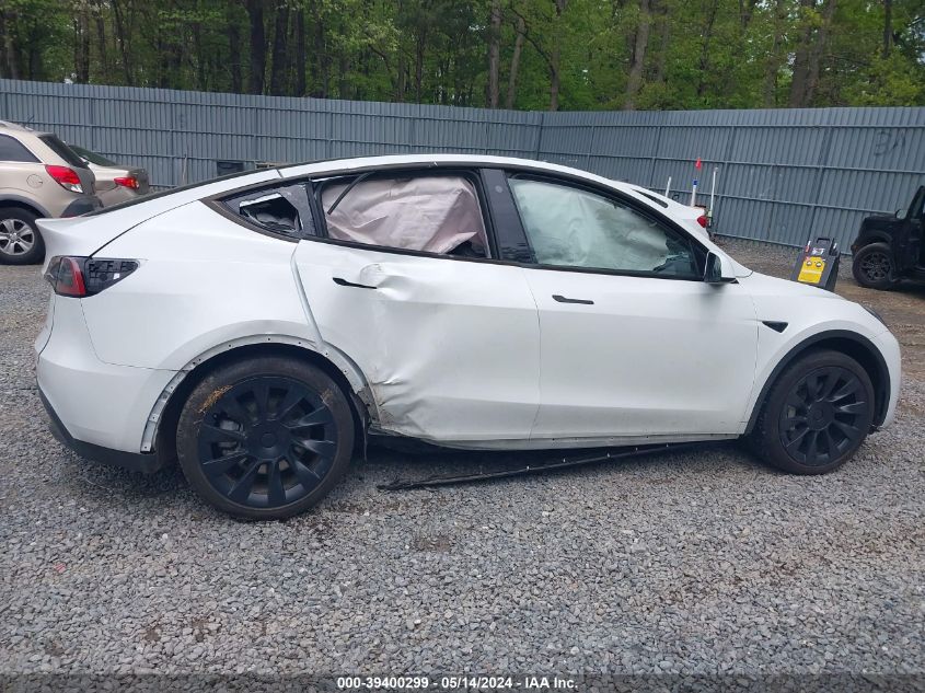 2023 Tesla Model Y Awd/Long Range Dual Motor All-Wheel Drive VIN: 7SAYGDEE4PA057212 Lot: 39400299