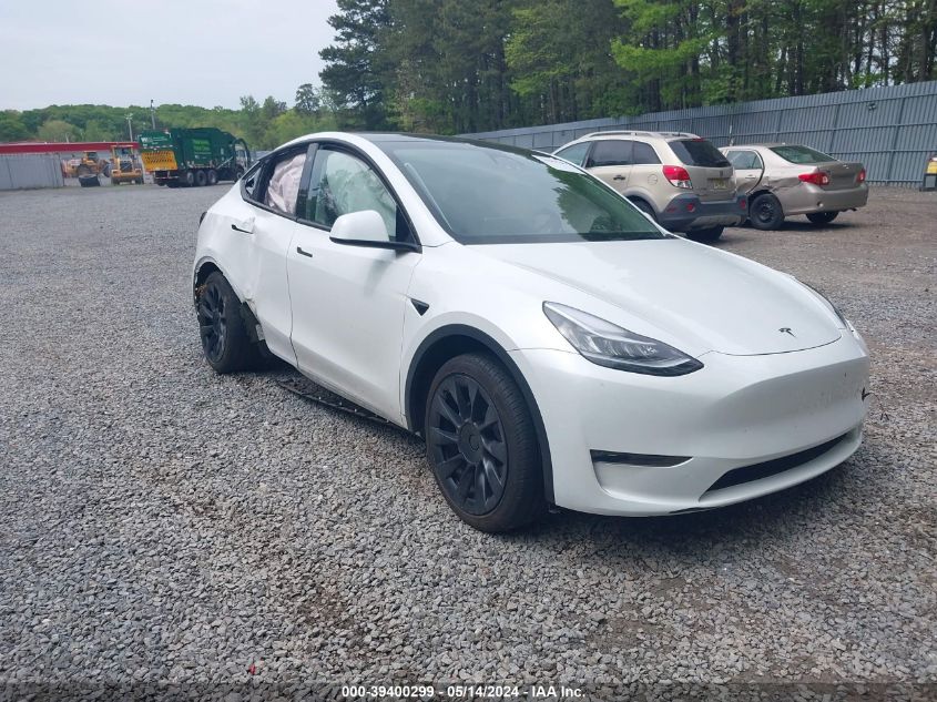 2023 Tesla Model Y Awd/Long Range Dual Motor All-Wheel Drive VIN: 7SAYGDEE4PA057212 Lot: 39400299