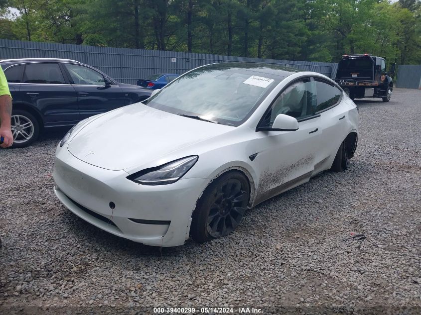 2023 Tesla Model Y Awd/Long Range Dual Motor All-Wheel Drive VIN: 7SAYGDEE4PA057212 Lot: 39400299