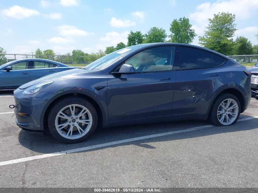 2023 Tesla Model Y Awd/Long Range Dual Motor All-Wheel Drive VIN: 7SAYGDEE4PA086595 Lot: 39402619