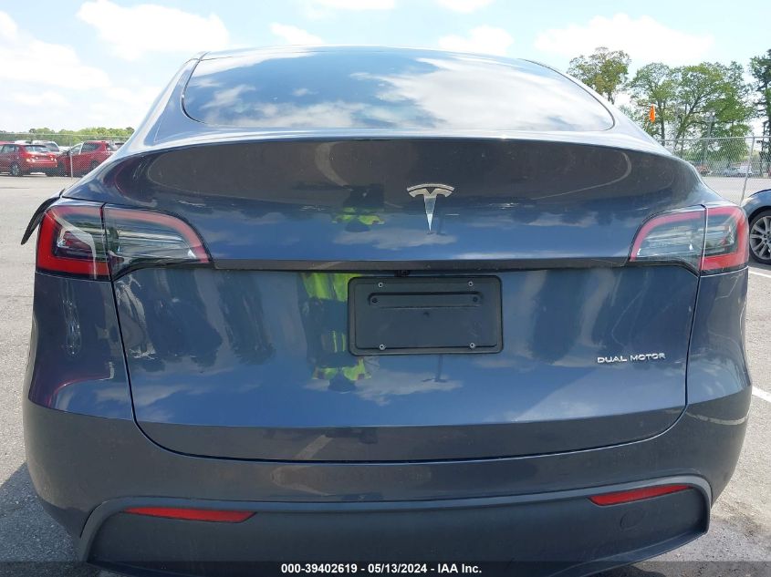 2023 Tesla Model Y Awd/Long Range Dual Motor All-Wheel Drive VIN: 7SAYGDEE4PA086595 Lot: 39402619