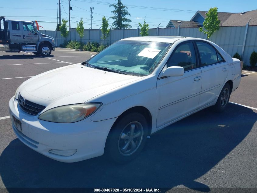 2003 Toyota Camry Le VIN: JTDBE32K730184724 Lot: 39407020