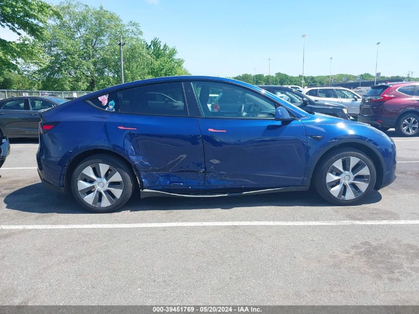 2023 Tesla Model Y Awd/Long Range Dual Motor All-Wheel Drive VIN: 7SAYGAEE6PF792145 Lot: 39451769