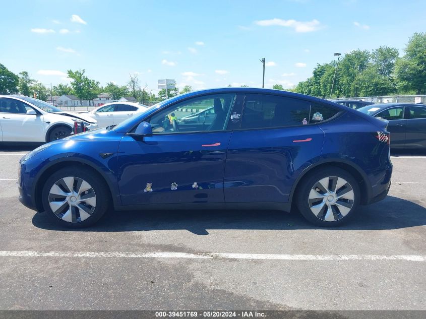 2023 Tesla Model Y Awd/Long Range Dual Motor All-Wheel Drive VIN: 7SAYGAEE6PF792145 Lot: 39451769