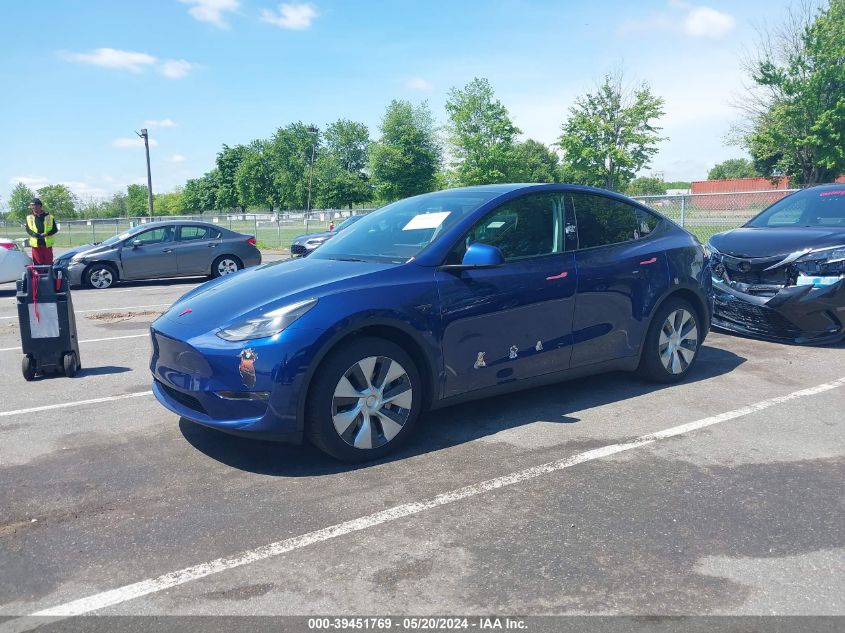 2023 Tesla Model Y Awd/Long Range Dual Motor All-Wheel Drive VIN: 7SAYGAEE6PF792145 Lot: 39451769