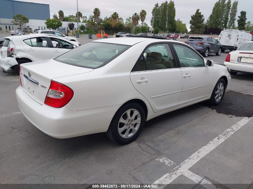 2004 Toyota Camry Le VIN: JTDBE30K040260904 Lot: 39452873