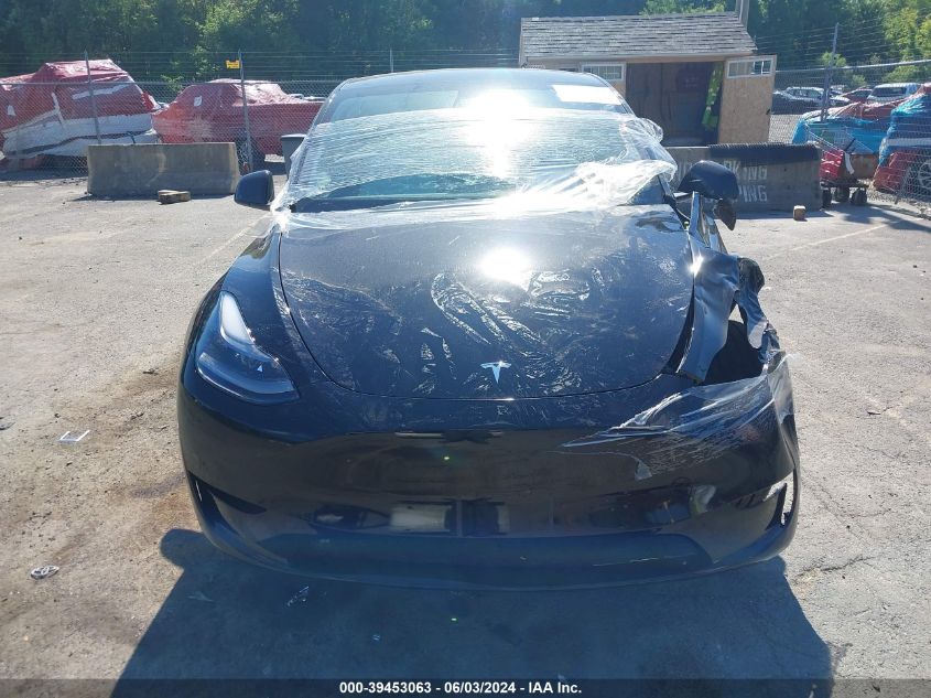 2023 Tesla Model Y Awd/Long Range Dual Motor All-Wheel Drive VIN: 7SAYGAEE6PF766239 Lot: 39453063