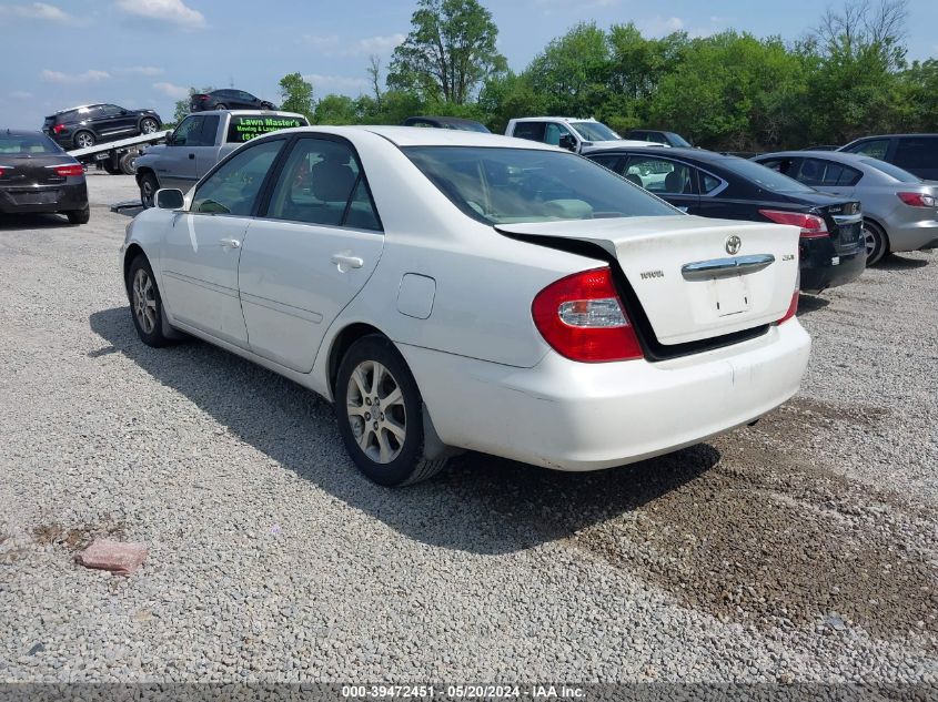 2004 Toyota Camry Le VIN: JTDBE32K940250157 Lot: 39472451