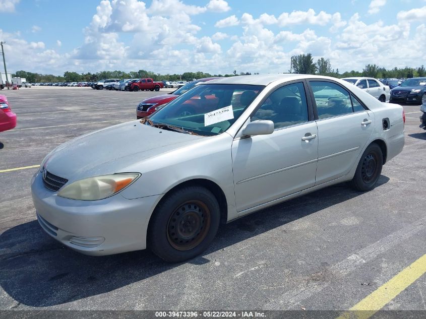 2002 Toyota Camry Le VIN: 4T1BE32K32U038906 Lot: 39473396