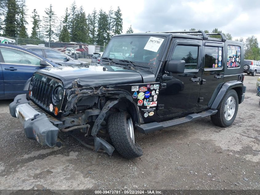 2009 Jeep Wrangler Unlimited Sahara VIN: 1J8GA59129L703768 Lot: 39473781