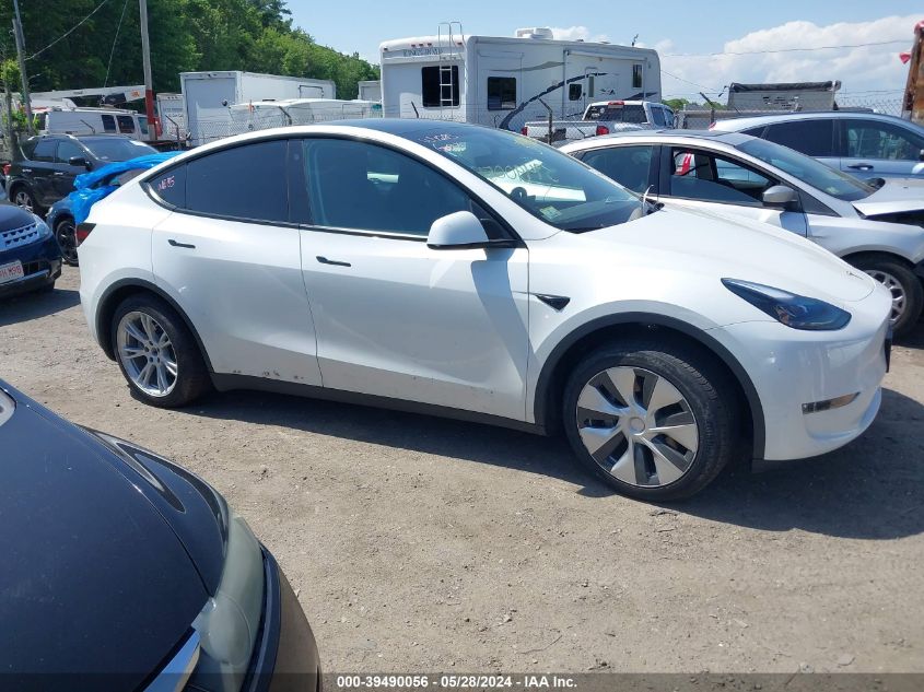 2023 Tesla Model Y Awd/Long Range Dual Motor All-Wheel Drive VIN: 7SAYGAEE0PF770285 Lot: 39490056