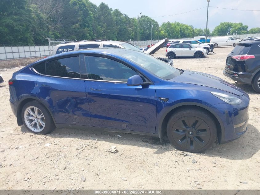 2023 Tesla Model Y Awd/Long Range Dual Motor All-Wheel Drive VIN: 7SAYGAEE6PF582435 Lot: 39504071