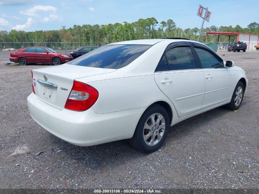 2004 Toyota Camry Le VIN: JTDBE32K640287909 Lot: 39513106