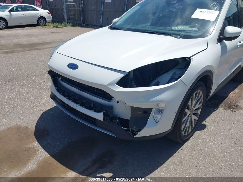 2021 Ford Escape Titanium VIN: 1FMCU9J97MUA70799 Lot: 39517033