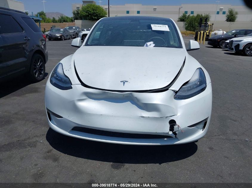 2023 Tesla Model Y Awd/Long Range Dual Motor All-Wheel Drive VIN: 7SAYGDEE3PA031197 Lot: 39518774